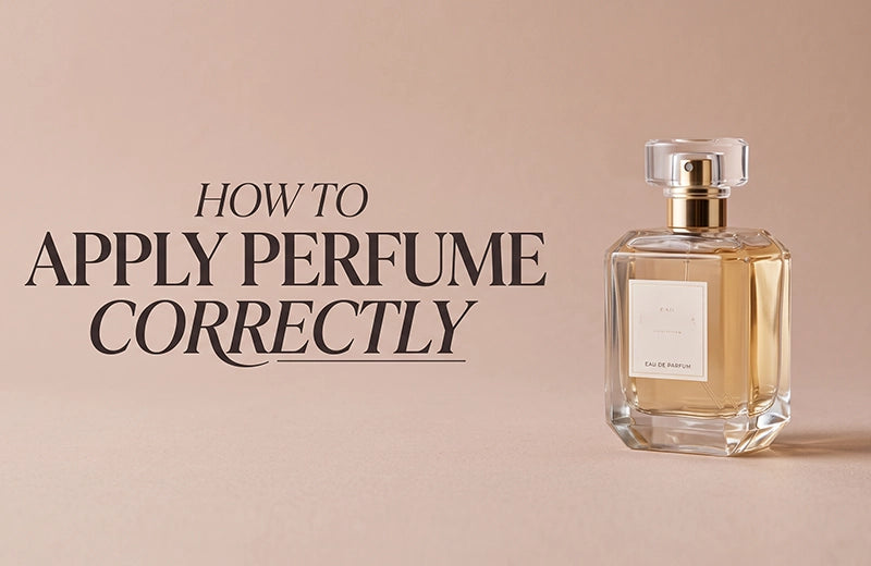 Faceted glass eau de parfum bottle with a gold collar against a soft blush background