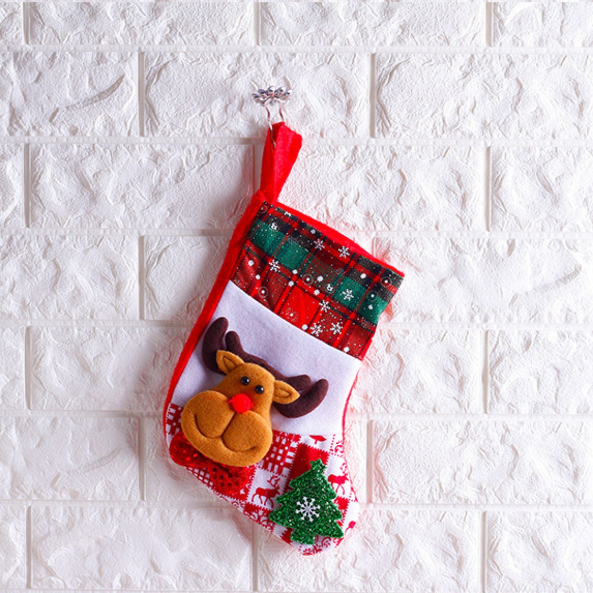 Small Christmas stocking with reindeer character, tartan-style cuff and mini tree