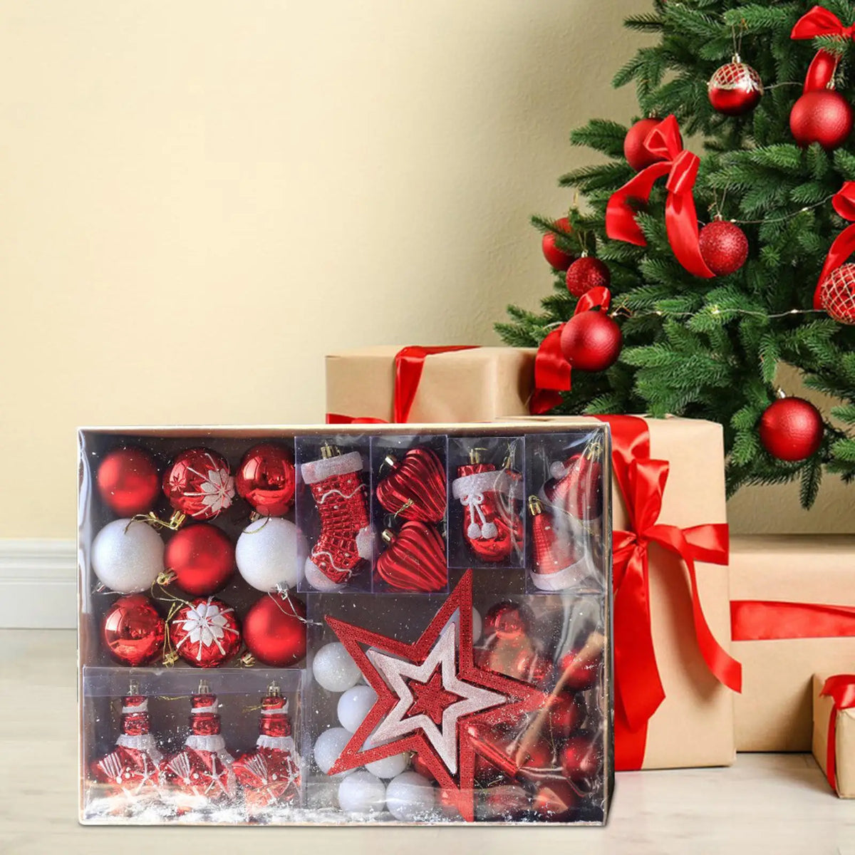Red and white Christmas bauble set box beside a decorated Christmas tree and wrapped gifts