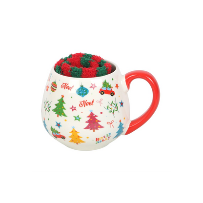 Retro print Christmas mug with red handle filled with red and green striped fluffy socks