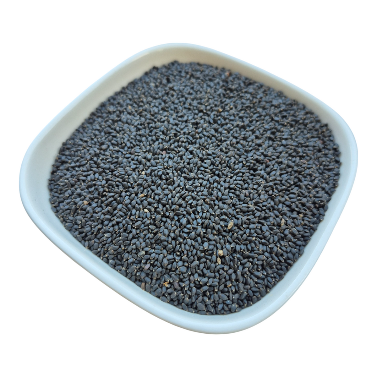 The seeds in a white dish, side view