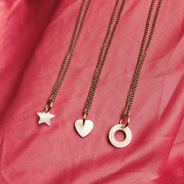 Three mother of pearl pendant necklaces: star, heart and circle