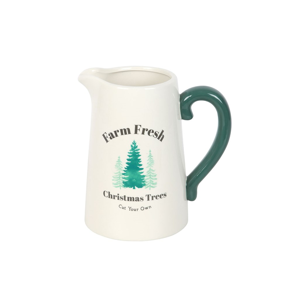 Cream ceramic jug printed with Farm Fresh Christmas Trees Cut Your Own and green fir trees