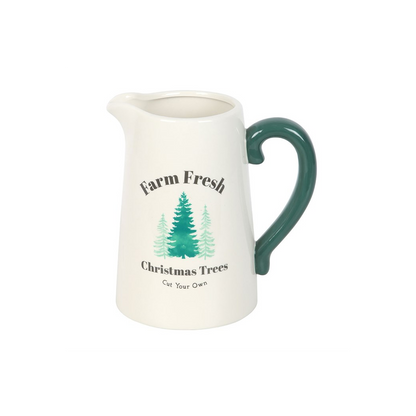 Cream ceramic jug printed with Farm Fresh Christmas Trees Cut Your Own and green fir trees