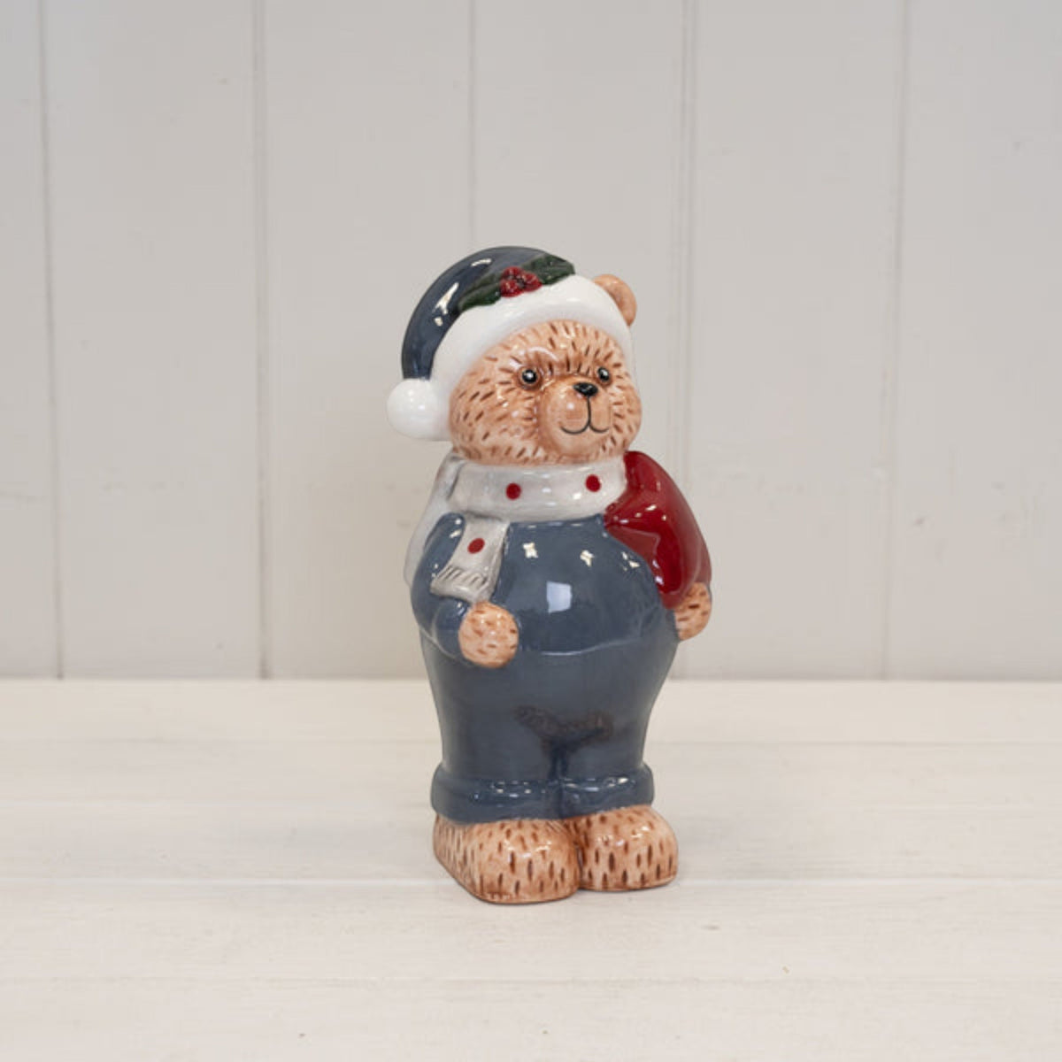 21cm winter blue ceramic Christmas bear figurine on a white shelf