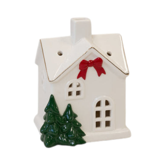 Glossy white ceramic Christmas house with red bow, green fir trees and gold-edged roof