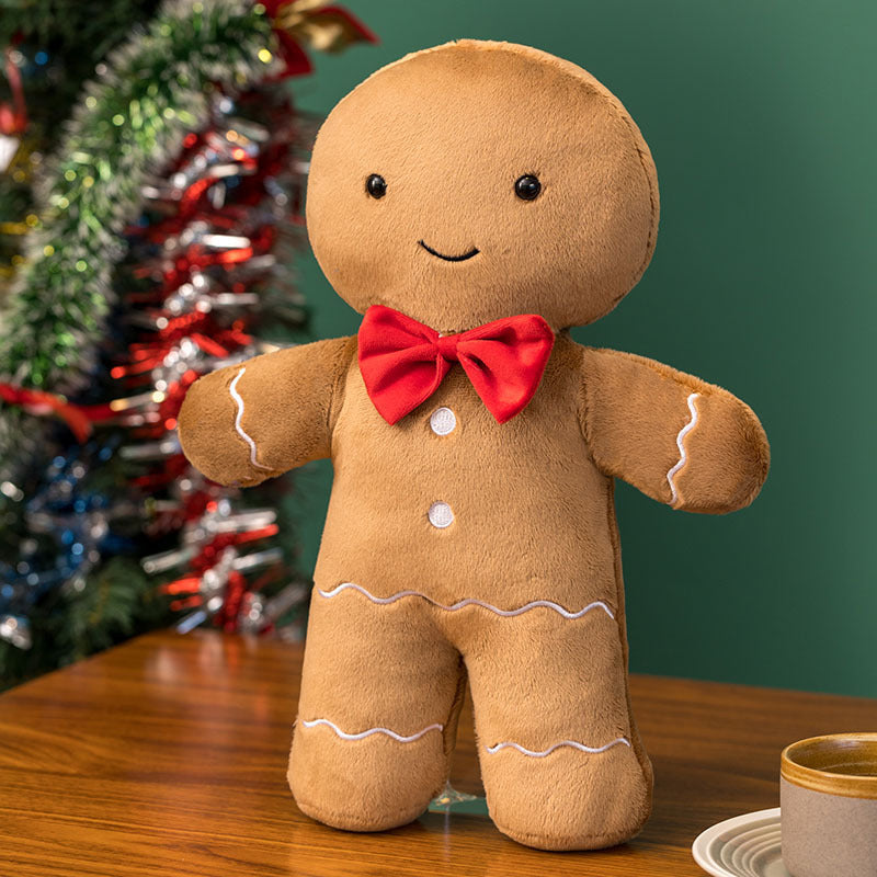 Gingerbread man plush toy with red bow tie