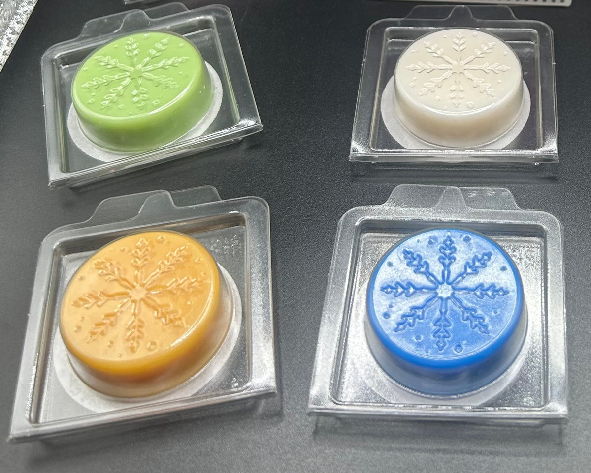 Snowflake-embossed Christmas wax melts in clear protective packs