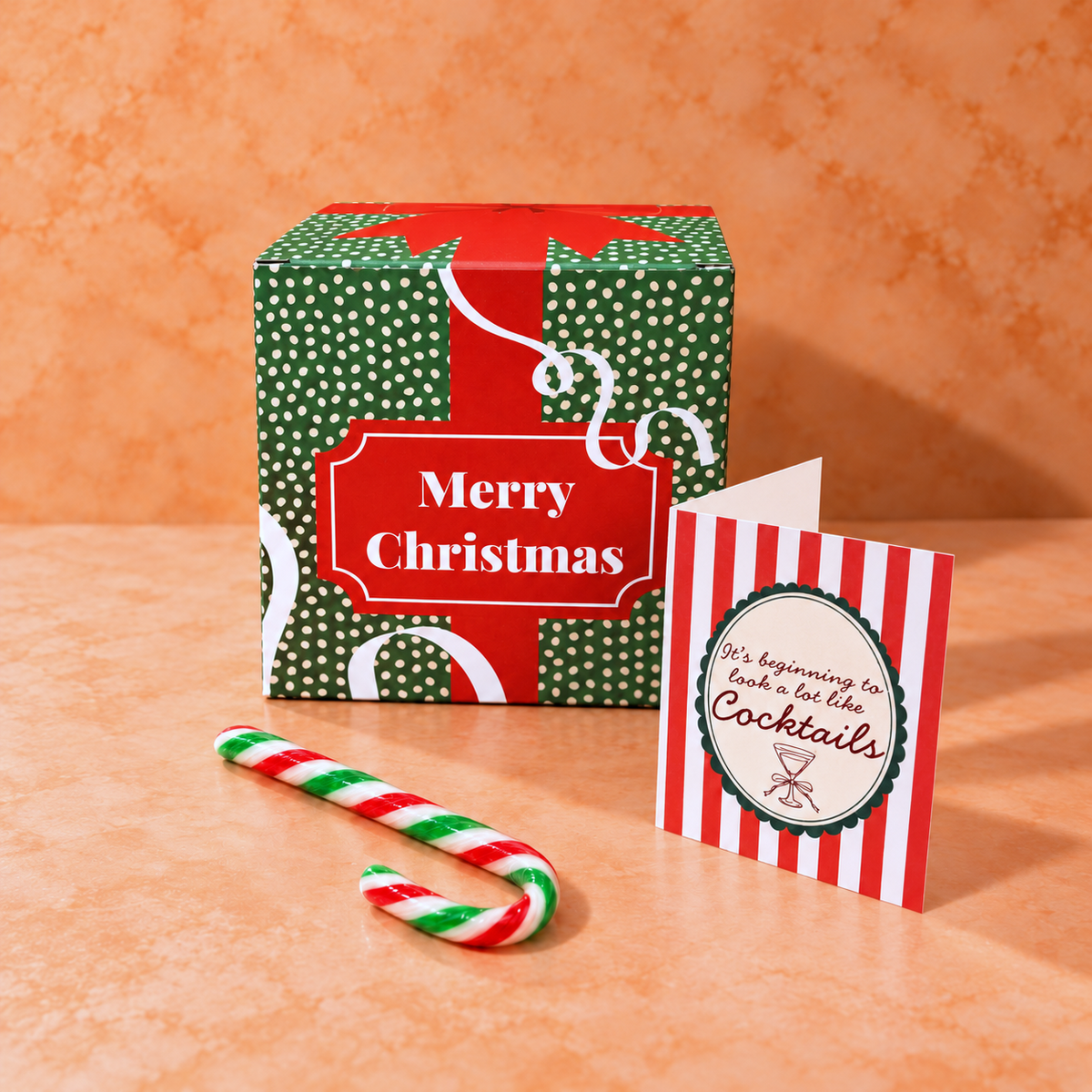 Merry Christmas cocktail gift box with festive card and candy cane