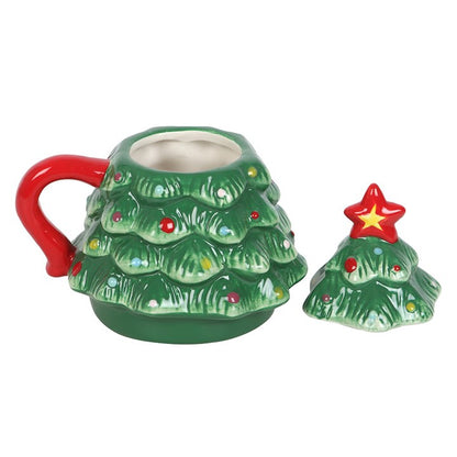 Green Christmas tree mug with red handle and its star-topped lid off
