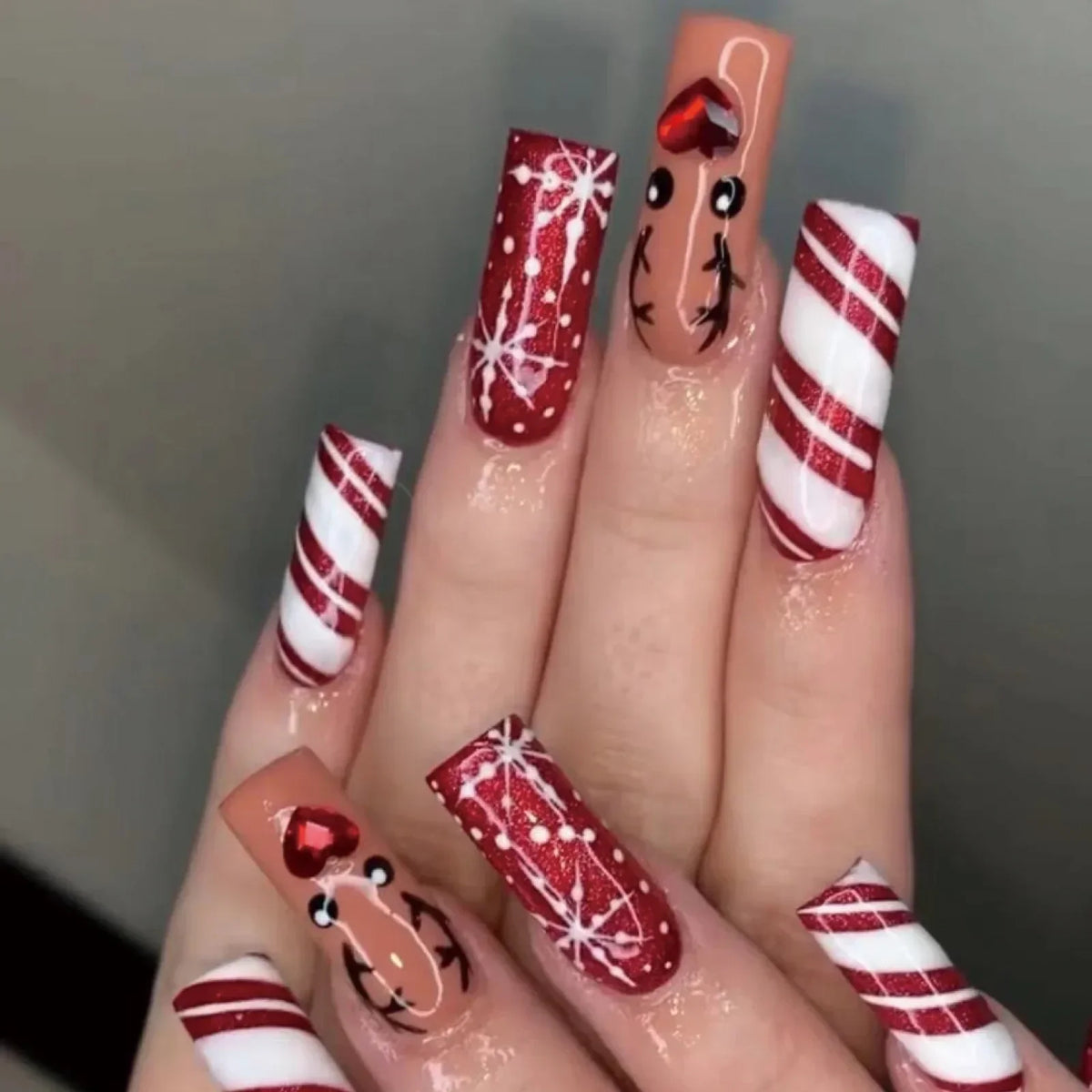 Long red glitter, candy cane and reindeer Christmas press-on nails