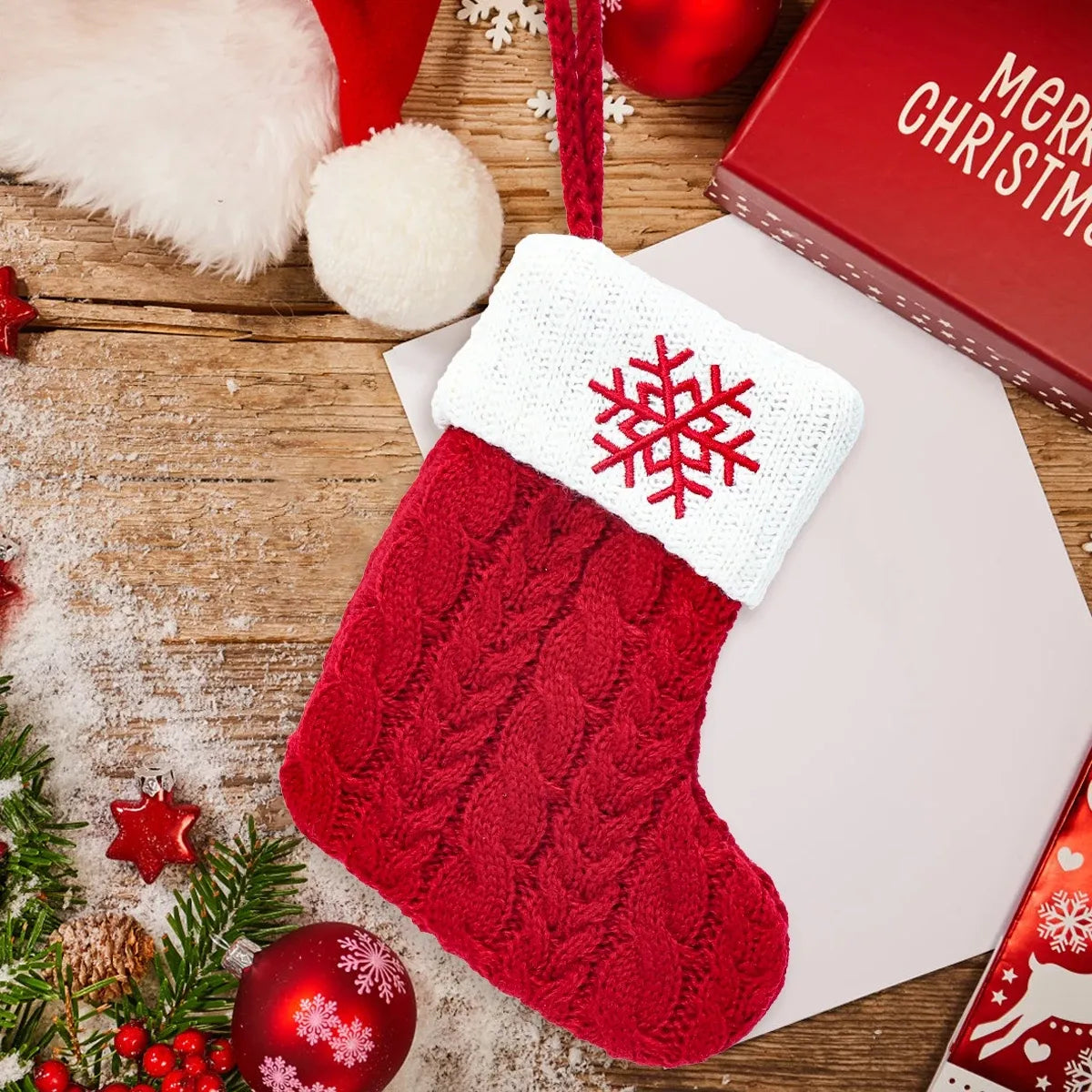 Mini red cable-knit Christmas stocking with white snowflake cuff