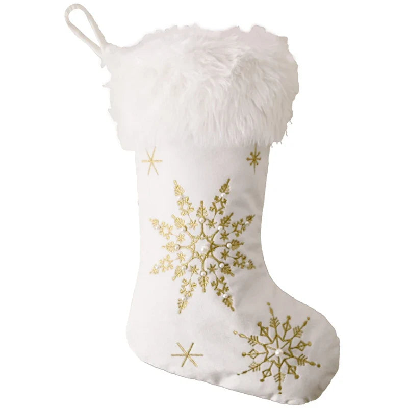 White plush Christmas stocking with gold embroidered snowflakes and fluffy cuff