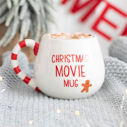 White Christmas Movie Mug with hot chocolate on a grey knitted blanket