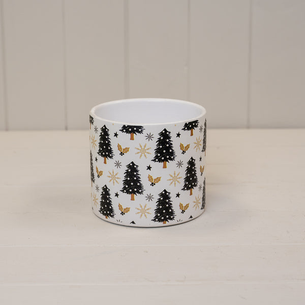 Black and gold Christmas tree print pot on a white shelf