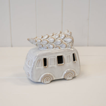 Ceramic Christmas campervan on a white wooden shelf