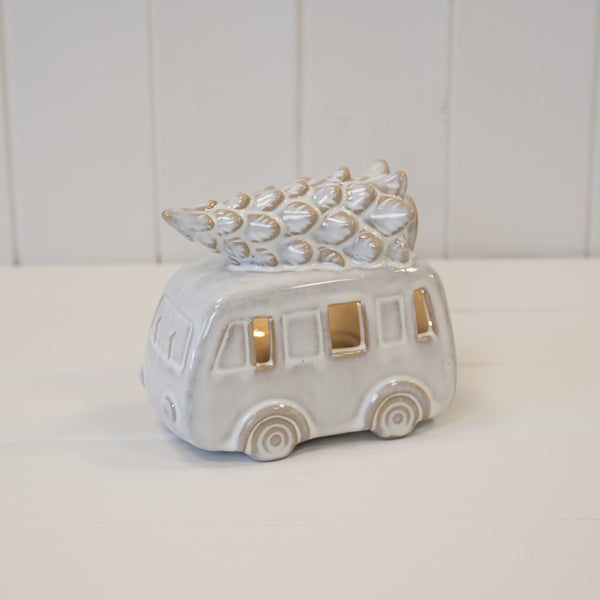 Ceramic campervan with Christmas tree on roof and warmly glowing windows
