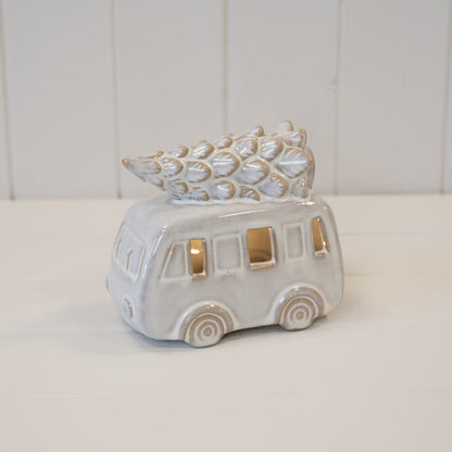 Ceramic campervan with Christmas tree on roof and warmly glowing windows